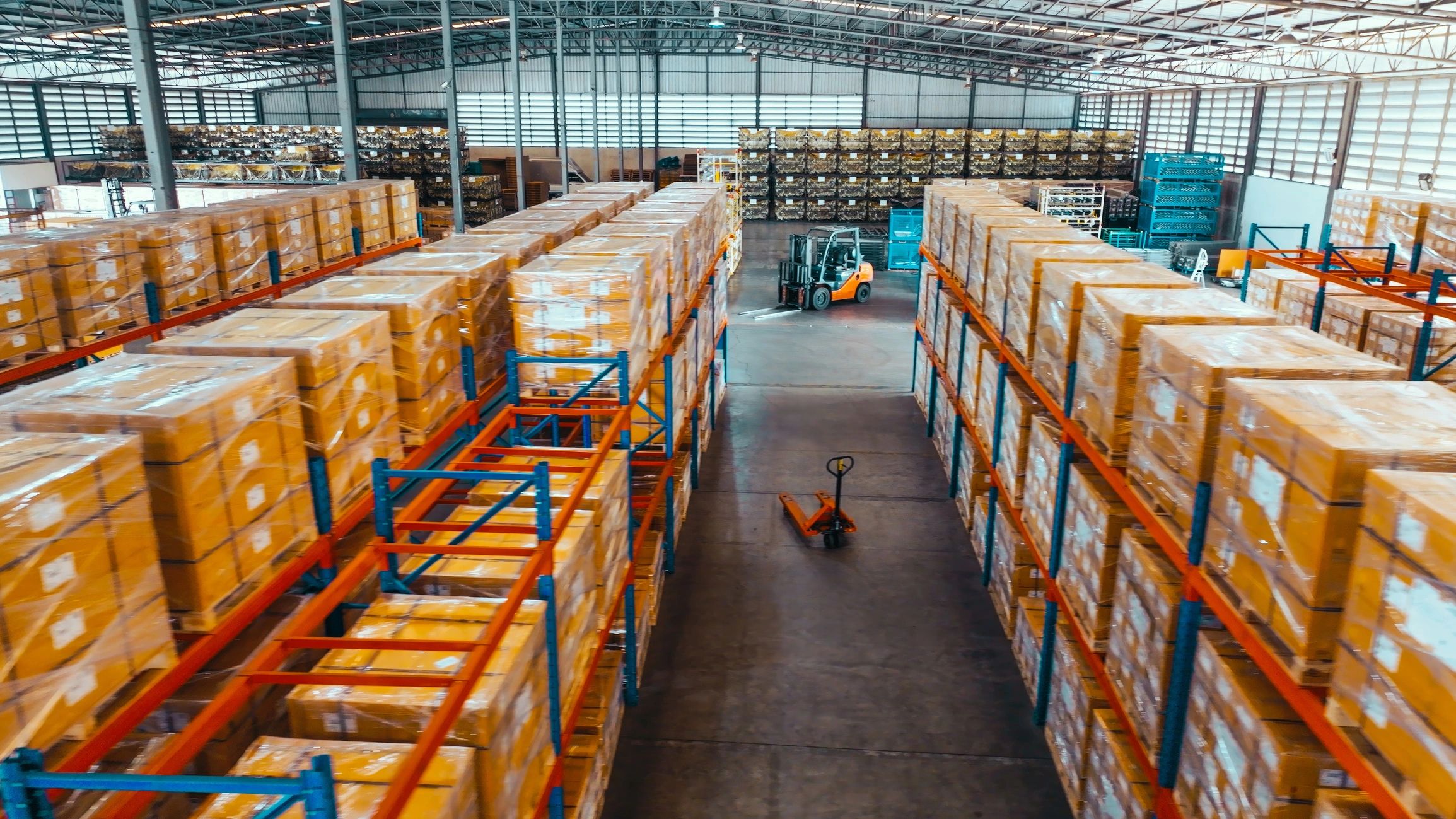 Warehouse shelves with packaged orders ready for processing